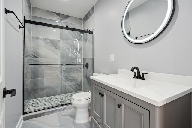 bathroom with walk in shower, vanity, and toilet