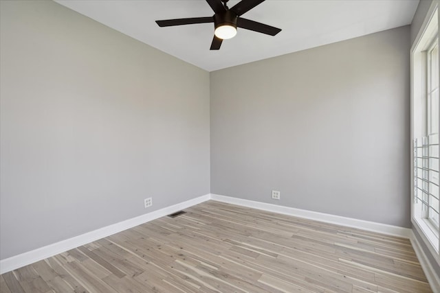 unfurnished room with light wood-type flooring and ceiling fan