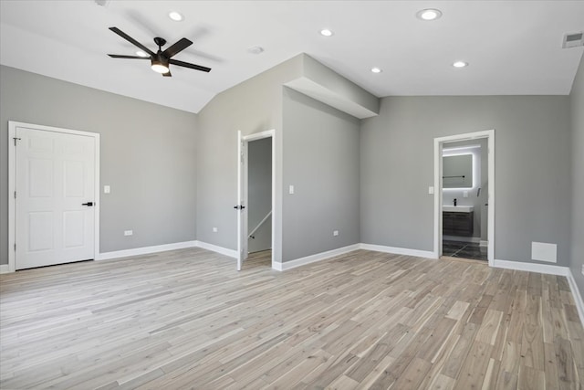 unfurnished living room featuring vaulted ceiling, ceiling fan, and light hardwood / wood-style flooring