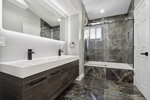 bathroom with enclosed tub / shower combo and vanity