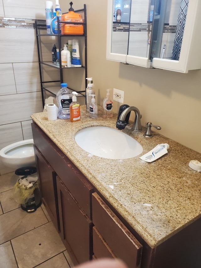 bathroom featuring tile patterned flooring and vanity