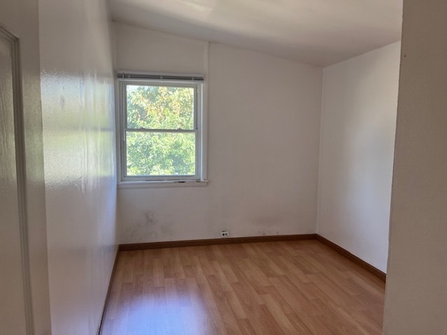 unfurnished room featuring light hardwood / wood-style flooring