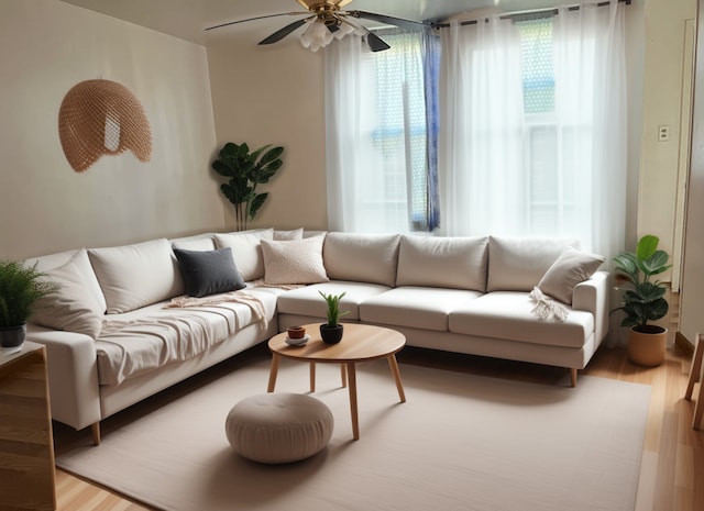 living room featuring light wood-type flooring and ceiling fan