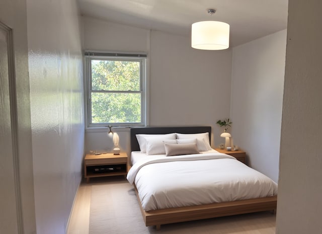 bedroom with hardwood / wood-style floors