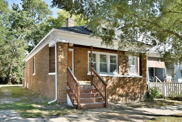 340 Pine St, Joliet, IL 60435 - view of front of home with brick siding and a chimney