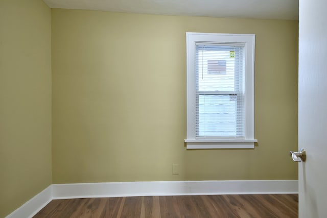 empty room with hardwood / wood-style flooring