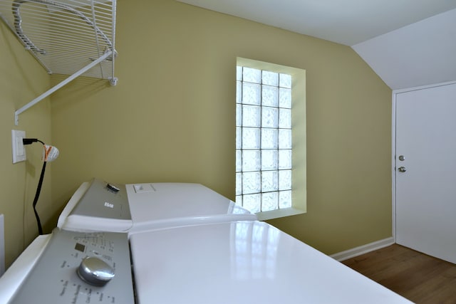 laundry area featuring wood-type flooring and washing machine and clothes dryer