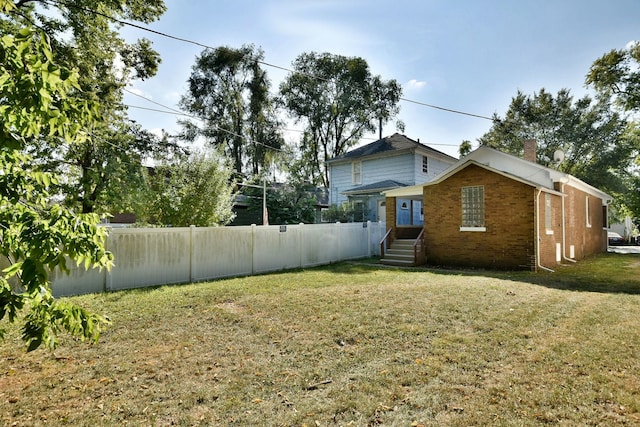 view of home's exterior with a yard