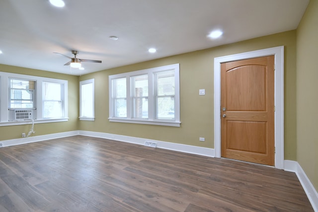 foyer featuring cooling unit, plenty of natural light, ceiling fan, and dark hardwood / wood-style flooring