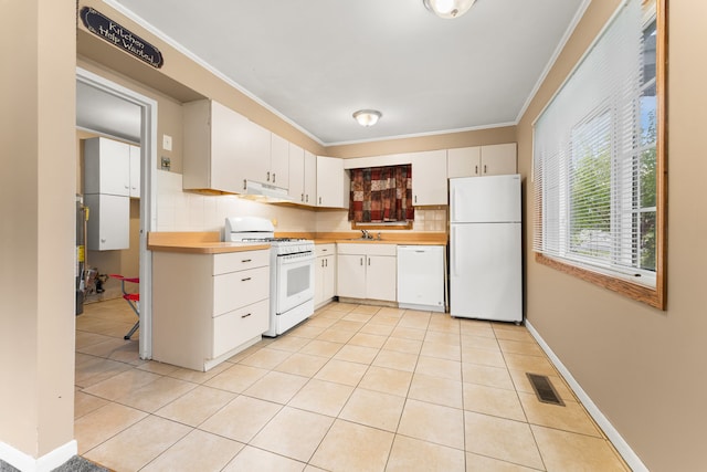 kitchen featuring white cabinets, white appliances, extractor fan, and backsplash