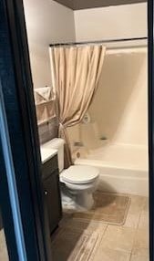 full bathroom with vanity, toilet, shower / bathtub combination with curtain, and tile patterned floors