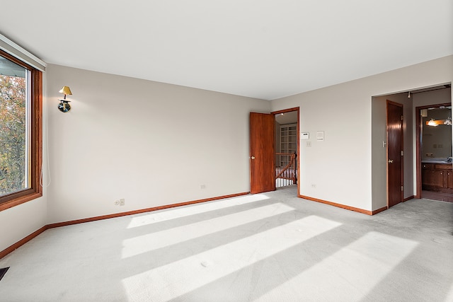 interior space featuring light colored carpet