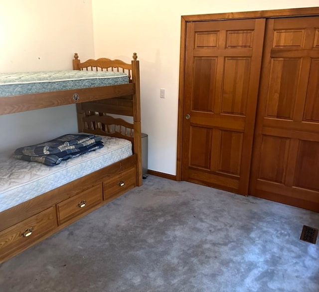 bedroom featuring carpet floors and a closet