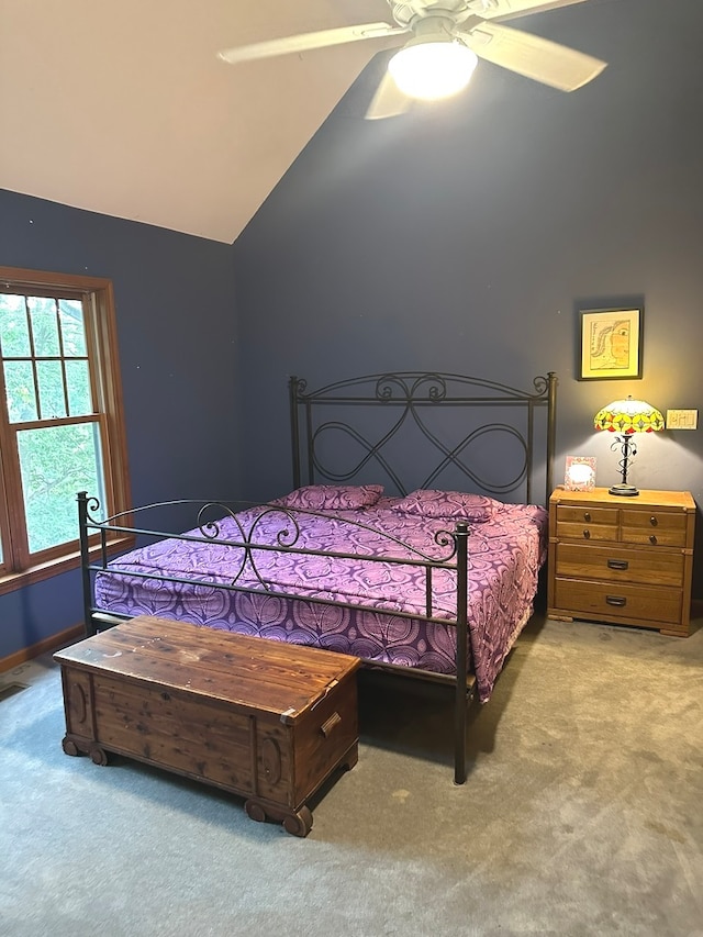 carpeted bedroom featuring lofted ceiling and ceiling fan