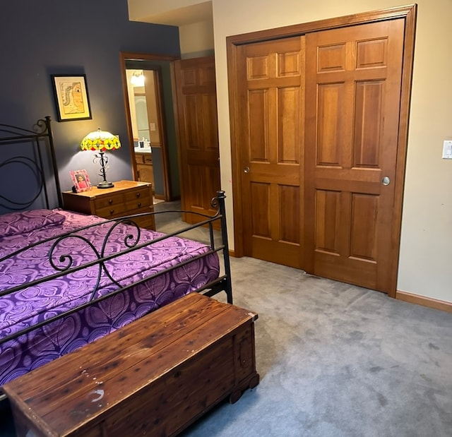 carpeted bedroom featuring a closet