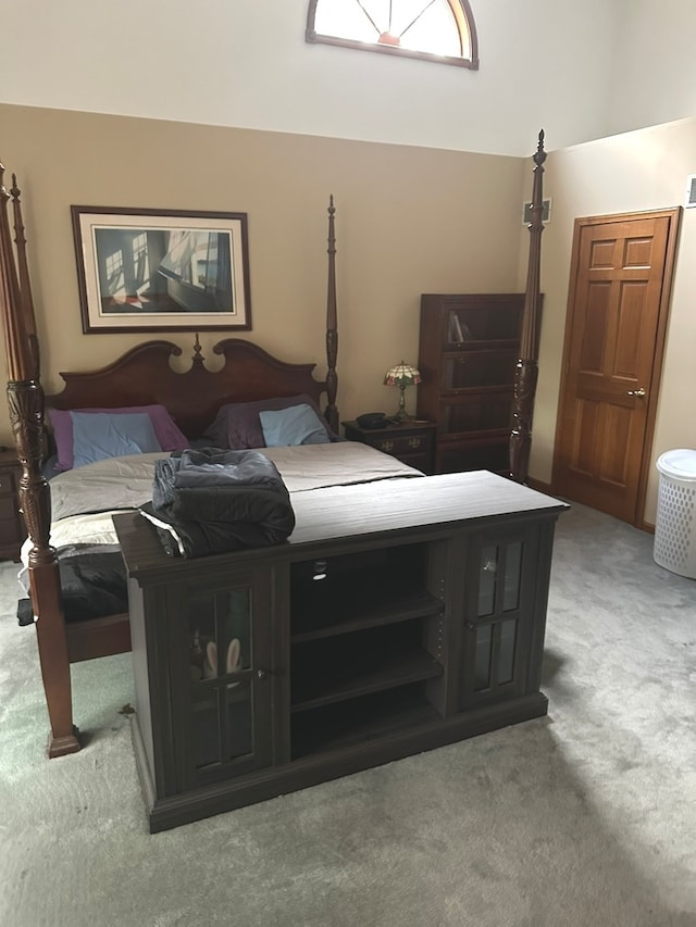 bedroom featuring light colored carpet