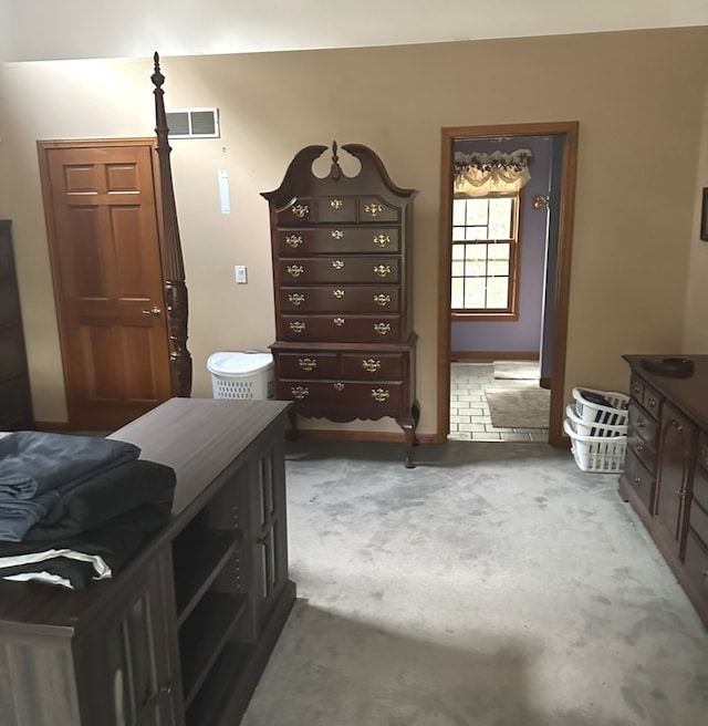 bedroom with dark colored carpet