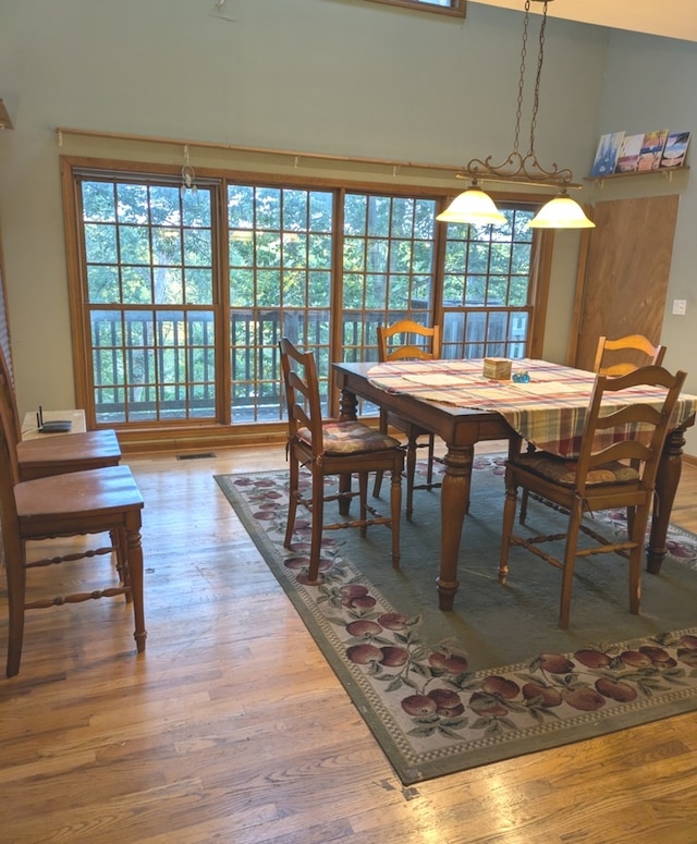 dining area with hardwood / wood-style floors