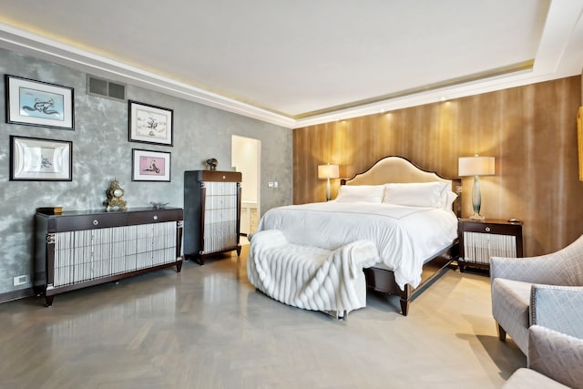 bedroom featuring radiator heating unit and parquet flooring