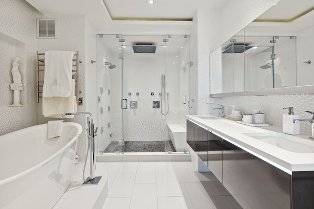 bathroom with vanity, radiator heating unit, plus walk in shower, and tile patterned floors