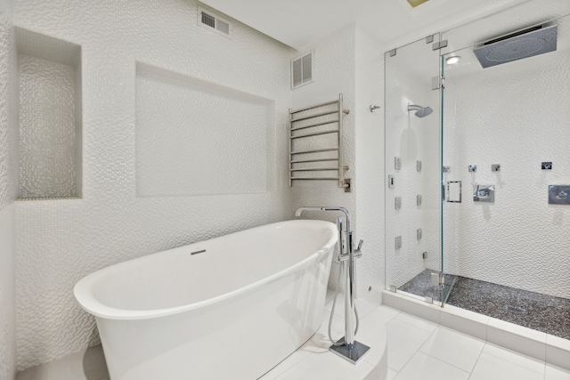 bathroom featuring shower with separate bathtub and tile patterned floors