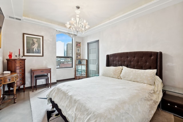 bedroom with an inviting chandelier and concrete floors