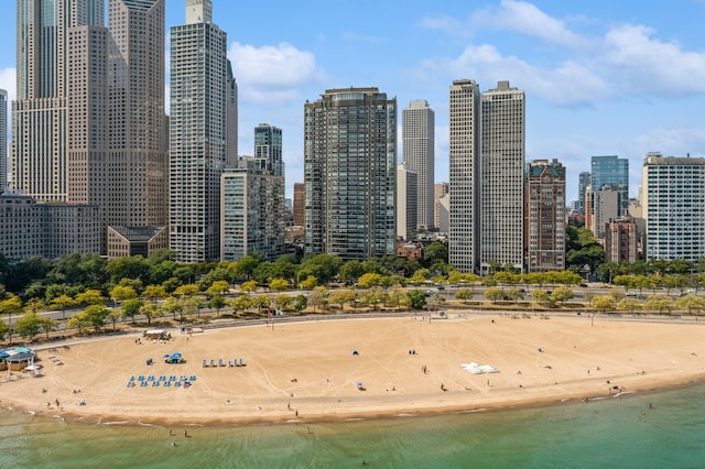 view of city with a water view and a beach view