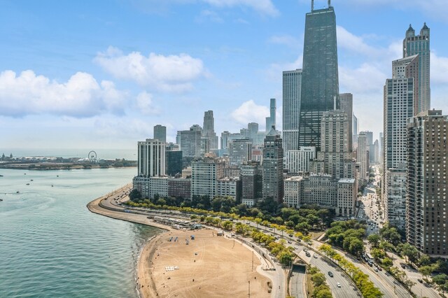 property's view of city with a water view