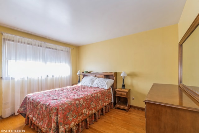 bedroom with light wood-type flooring