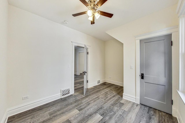 empty room with ceiling fan and wood-type flooring