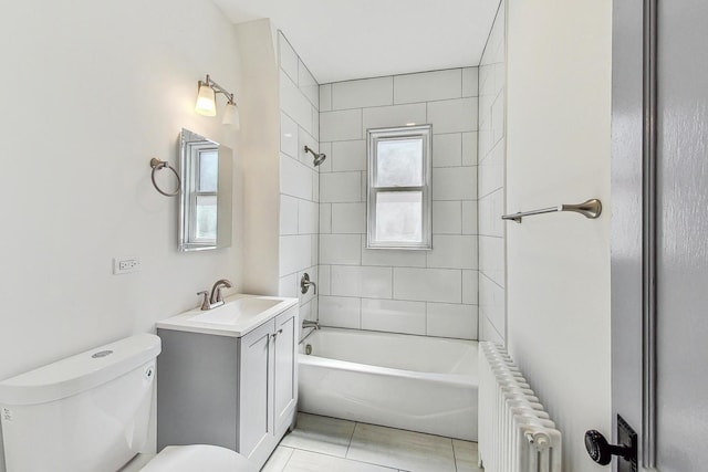 full bathroom featuring radiator heating unit, a wealth of natural light, vanity, and toilet