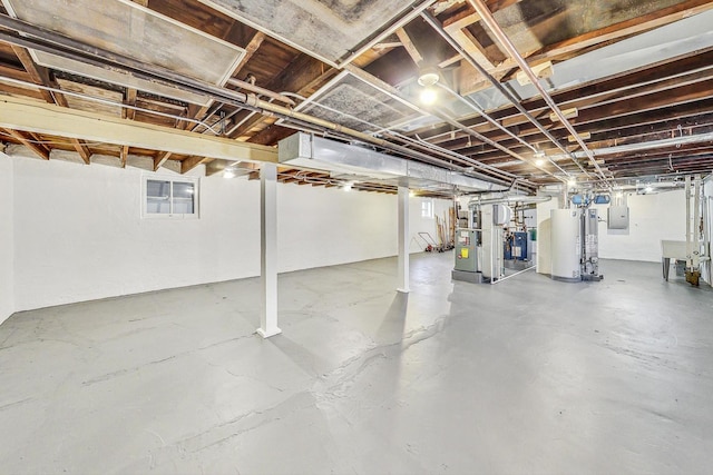 basement featuring gas water heater and electric panel