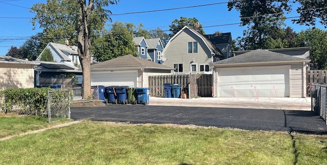 exterior space featuring a front yard and a garage