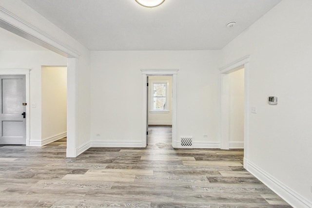 unfurnished room featuring hardwood / wood-style floors