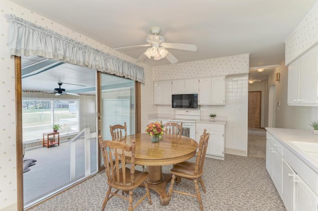 dining space featuring ceiling fan