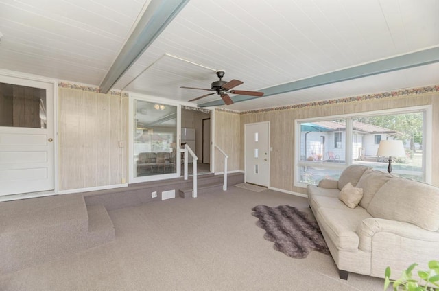 living room featuring carpet and ceiling fan