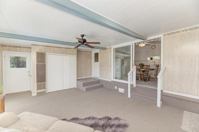 carpeted living room featuring ceiling fan