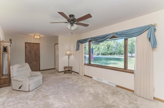 unfurnished room with ceiling fan, ornamental molding, and carpet