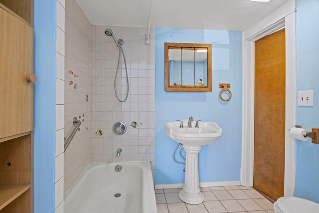 full bathroom featuring  shower combination, toilet, baseboards, and tile patterned floors