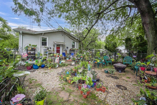 view of yard featuring fence and a fire pit