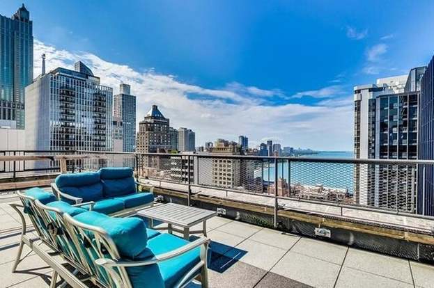 view of patio / terrace featuring outdoor lounge area, a balcony, and a water view