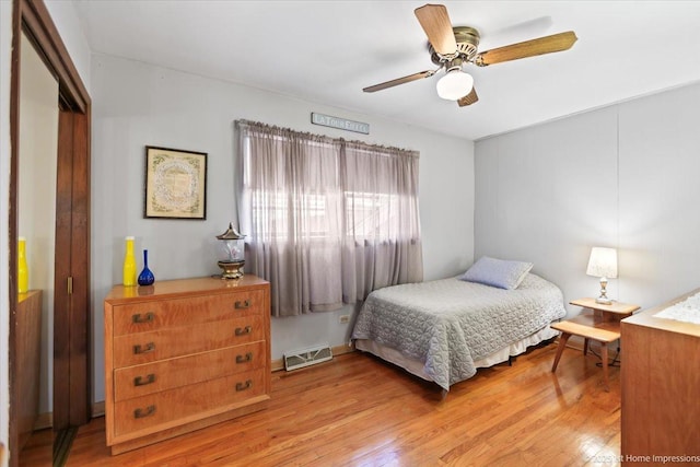 bedroom with a closet, ceiling fan, and light hardwood / wood-style flooring