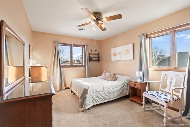 carpeted bedroom featuring ceiling fan