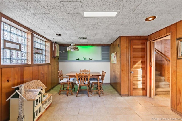 dining area with wooden walls