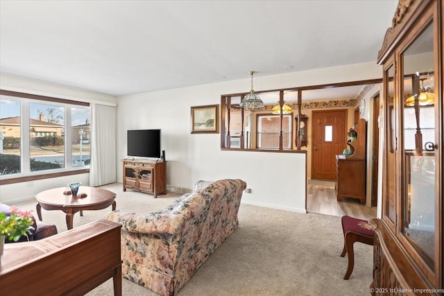 living room featuring light carpet