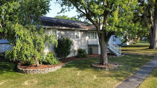 view of home's exterior with a yard