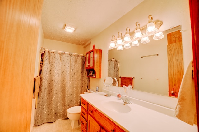 bathroom with a textured ceiling, vanity, toilet, and a shower with shower curtain