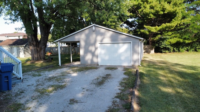 garage featuring a lawn