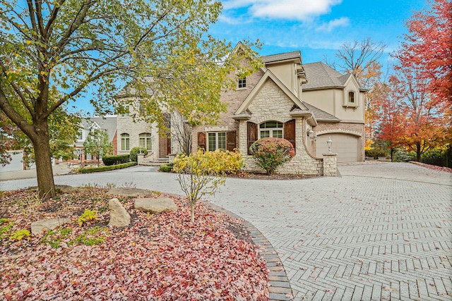 french country inspired facade with a garage