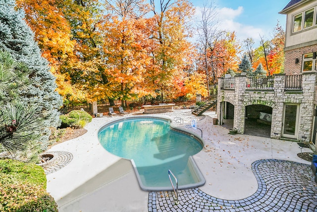 view of pool featuring a patio